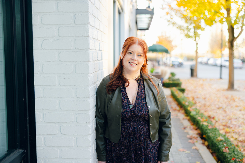 Dr. Meredith MacKenzie smiling outdoors in autumn, supporting women rethinking starting another diet.
